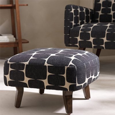Lohko footstool in black and white bubble pattern.